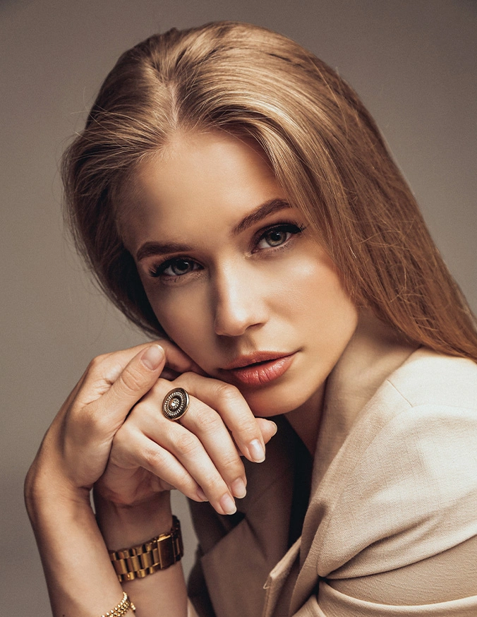 Blonde woman wearing elegant jewelry including statement ring and bracelet in professional portrait - Non-Surgical Facelift Radiofrequency assisted Liposuction in Las Vegas, NV